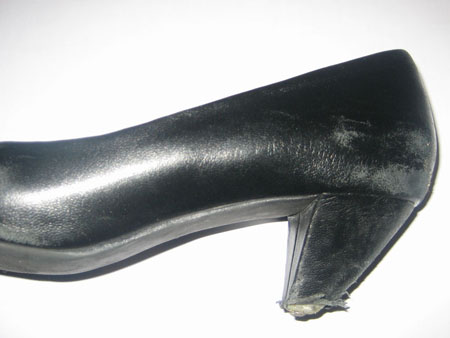 Damaged high heel, notice the metail pin protruding